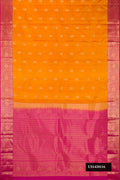 Mustard Dual Tone Kanchipuram Silk Saree with Zari Butta on the body and Zari Border.  displayed on a mannequin