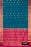 Peacock Blue Dual Tone Kanchipuram Silk Saree with Zari Butta on the body and Zari Border.  displayed on a mannequin