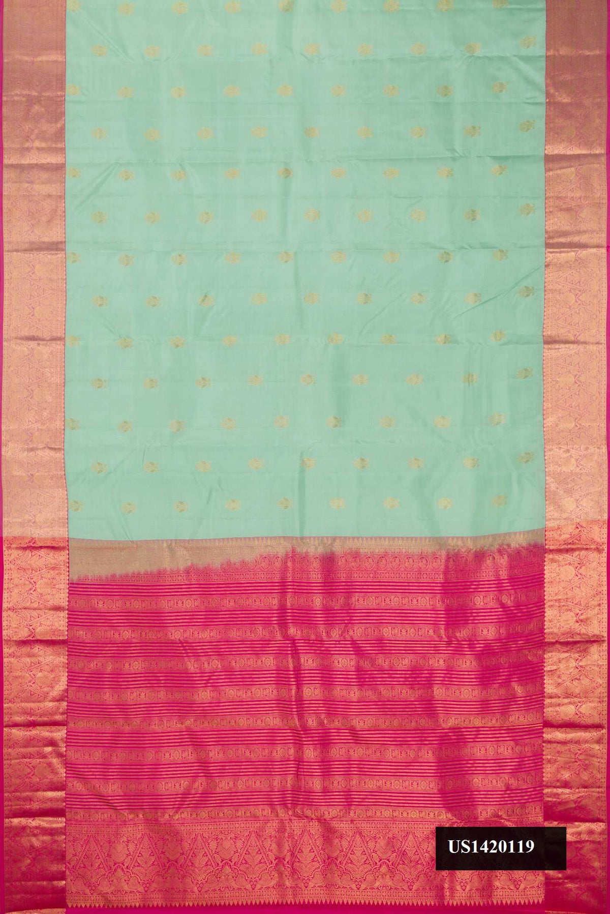 Pista Green Dual Tone Kanchipuram Silk Saree with Zari Butta on the body and Zari Border.  displayed on a mannequin