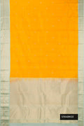 Mustard Dual Tone Kanchipuram Silk Saree with Zari Butta on the body and Zari Border.  displayed on a mannequin