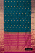 Peacock Blue Dual Tone Kanchipuram Silk Saree with Zari Butta on the body and Zari Border.  displayed on a mannequin