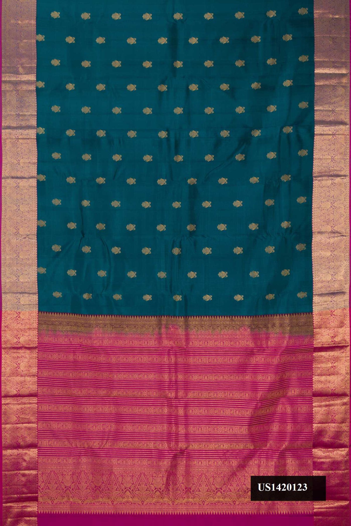 Peacock Blue Dual Tone Kanchipuram Silk Saree with Zari Butta on the body and Zari Border.  displayed on a mannequin