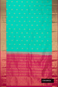 Sea Green Dual Tone Kanchipuram Silk Saree with Zari Butta on the body and Zari Border.  displayed on a mannequin