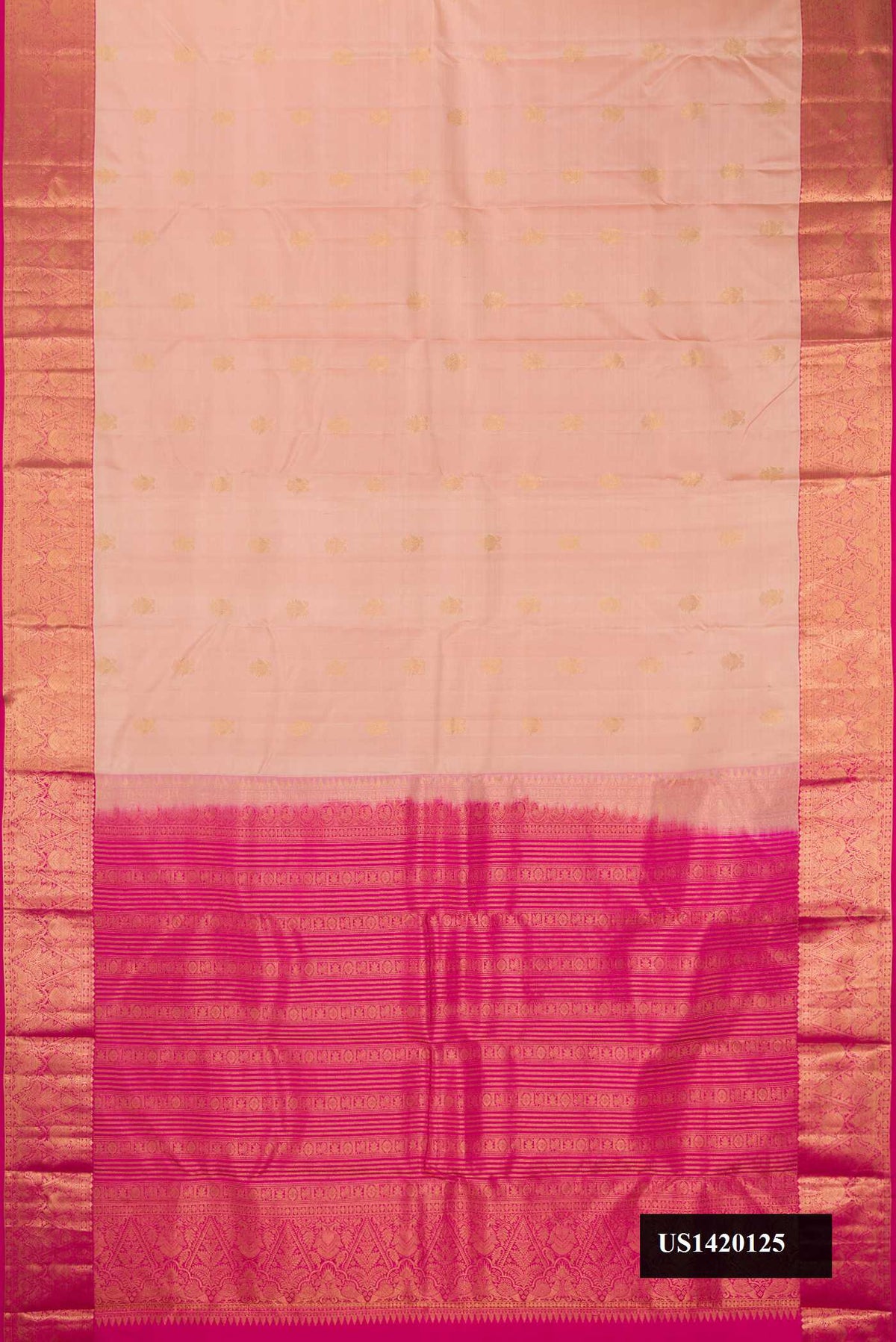 Beige Dual Tone Kanchipuram Silk Saree with Zari Butta on the body and Zari Border.  displayed on a mannequin