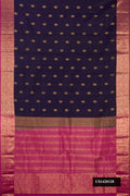 Navy Blue Dual Tone Kanchipuram Silk Saree with Zari Butta on the body and Zari Border.  displayed on a mannequin