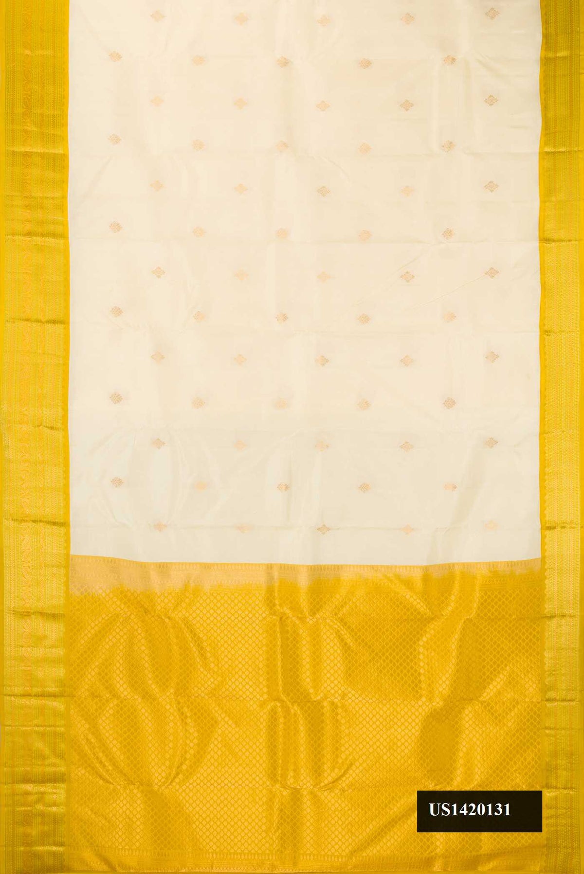 Off White Dual Tone Kanchipuram Silk Saree with Zari Butta on the body and Zari Border.  displayed on a mannequin