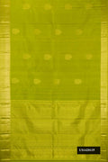 Parrot Green Dual Tone Kanchipuram Silk Saree with Zari Butta on the body and Zari Border.  displayed on a mannequin