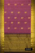 Rose Gold Dual Tone Kanchipuram Silk Saree with Zari Butta on the body and Zari Border.  displayed on a mannequin