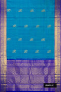 Blue Dual Tone Kanchipuram Silk Saree with Zari Butta on the body and Zari Border.  displayed on a mannequin