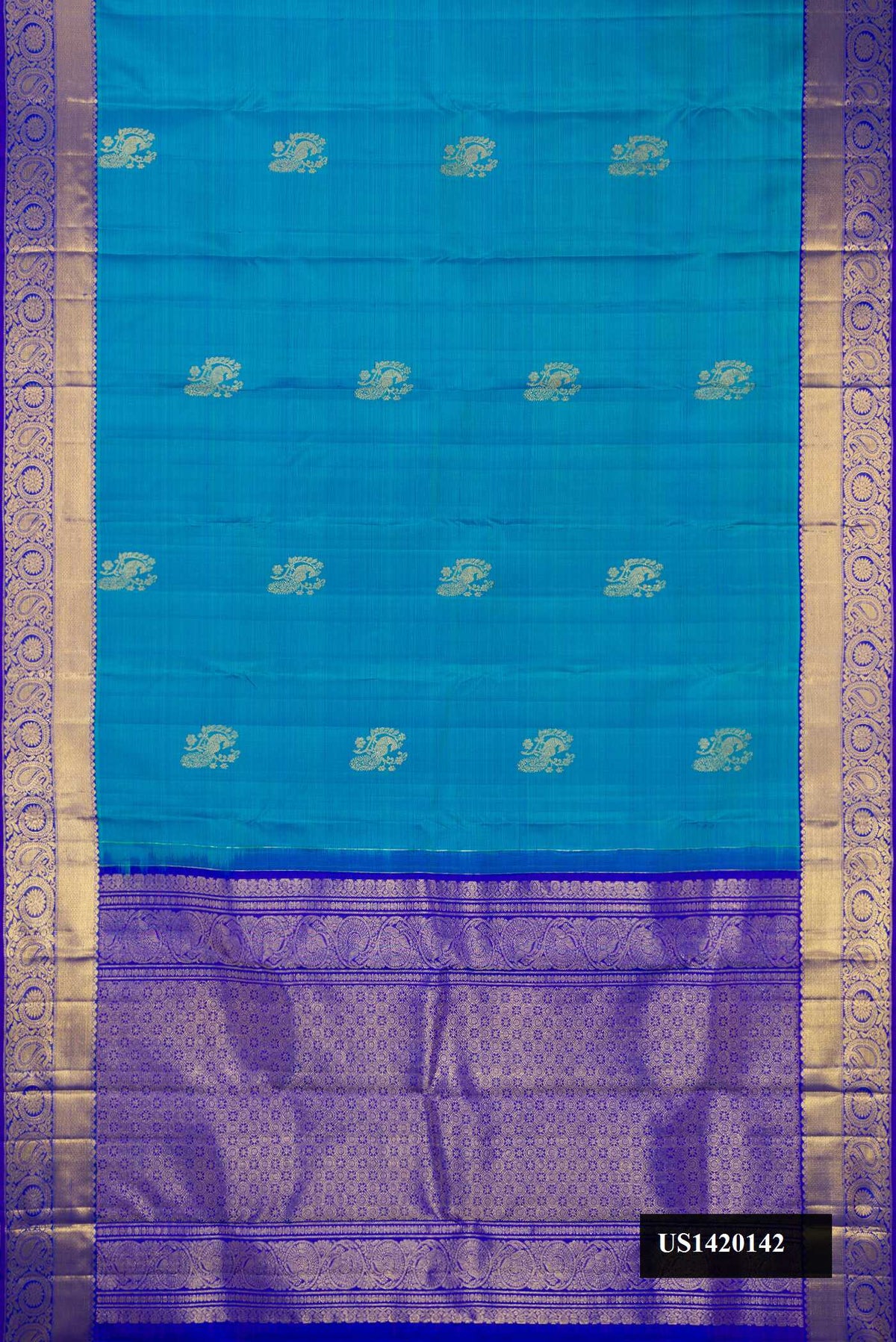 Blue Dual Tone Kanchipuram Silk Saree with Zari Butta on the body and Zari Border.  displayed on a mannequin
