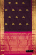 Burgundy Dual Tone Kanchipuram Silk Saree with Zari Butta on the body and Zari Border.  displayed on a mannequin