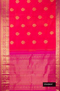 Coral Dual Tone Kanchipuram Silk Saree with Zari Butta on the body and Zari Border.  displayed on a mannequin