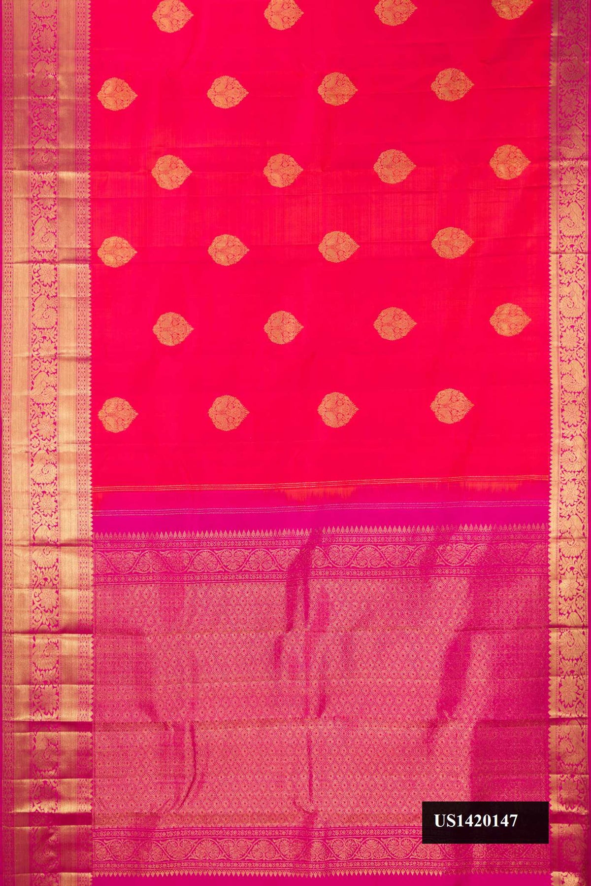 Coral Dual Tone Kanchipuram Silk Saree with Zari Butta on the body and Zari Border.  displayed on a mannequin