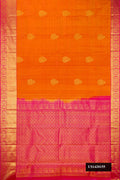 Mustard Dual Tone Kanchipuram Silk Saree with Zari Butta on the body and Zari Border.  displayed on a mannequin