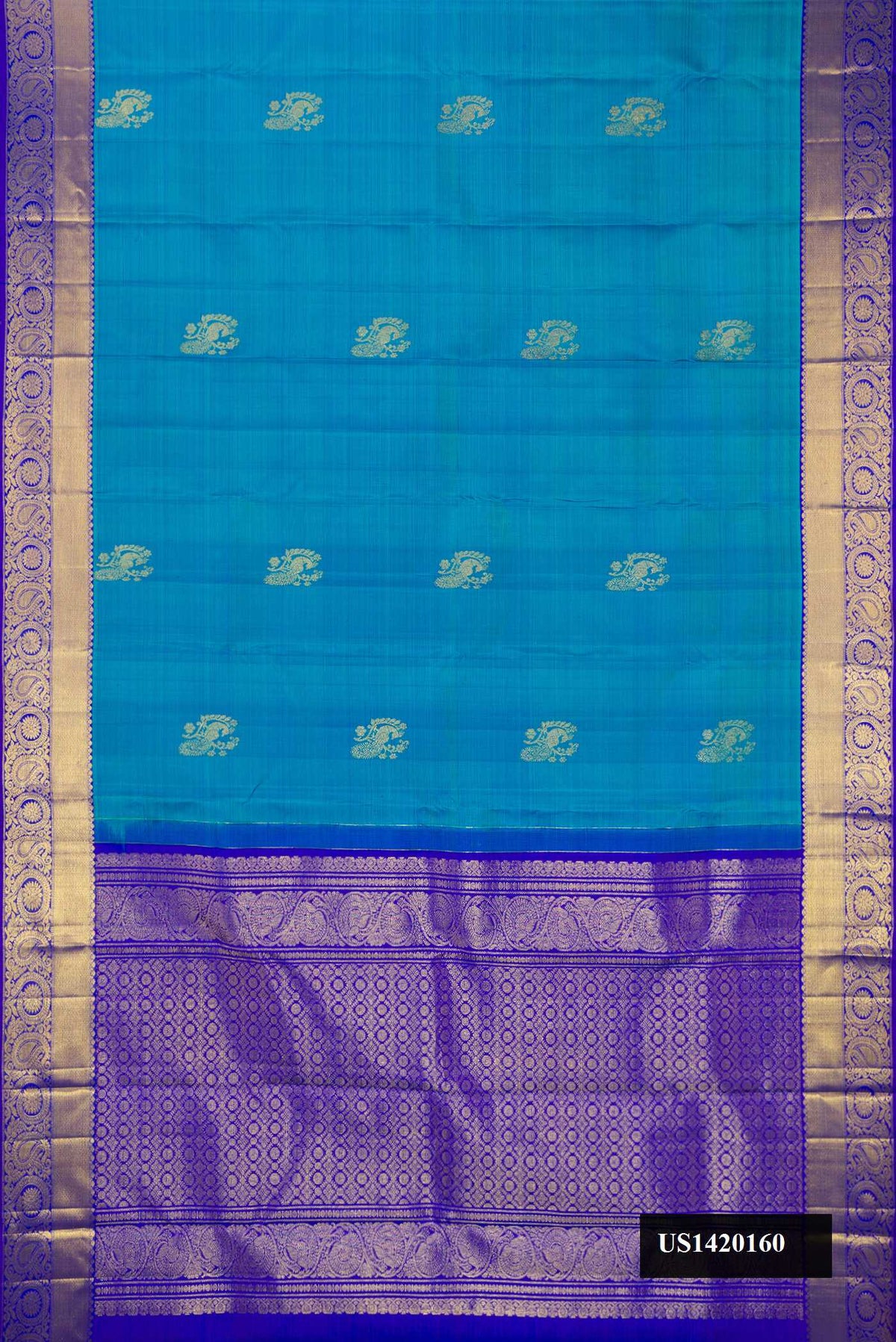 Blue Dual Tone Kanchipuram Silk Saree with Zari Butta on the body and Zari Border.  displayed on a mannequin
