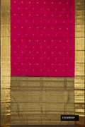 Maroon Dual Tone Kanchipuram Silk Saree with Zari Butta on the body and Zari Border.  displayed on a mannequin