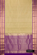 Pista Green Dual Tone Kanchipuram Silk Saree with Zari Butta on the body and Zari Border.  displayed on a mannequin