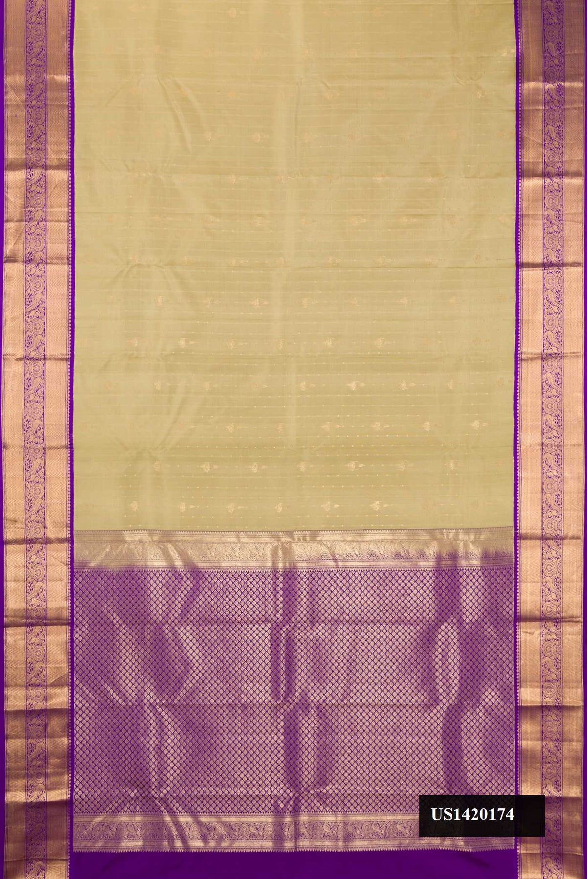 Pista Green Dual Tone Kanchipuram Silk Saree with Zari Butta on the body and Zari Border.  displayed on a mannequin