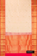 Beige Dual Tone Kanchipuram Silk Saree with Zari Butta on the body and Zari Border.  displayed on a mannequin