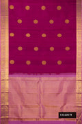 Magenta Dual Tone Kanchipuram Silk Saree with Zari Butta on the body and Zari Border.  displayed on a mannequin