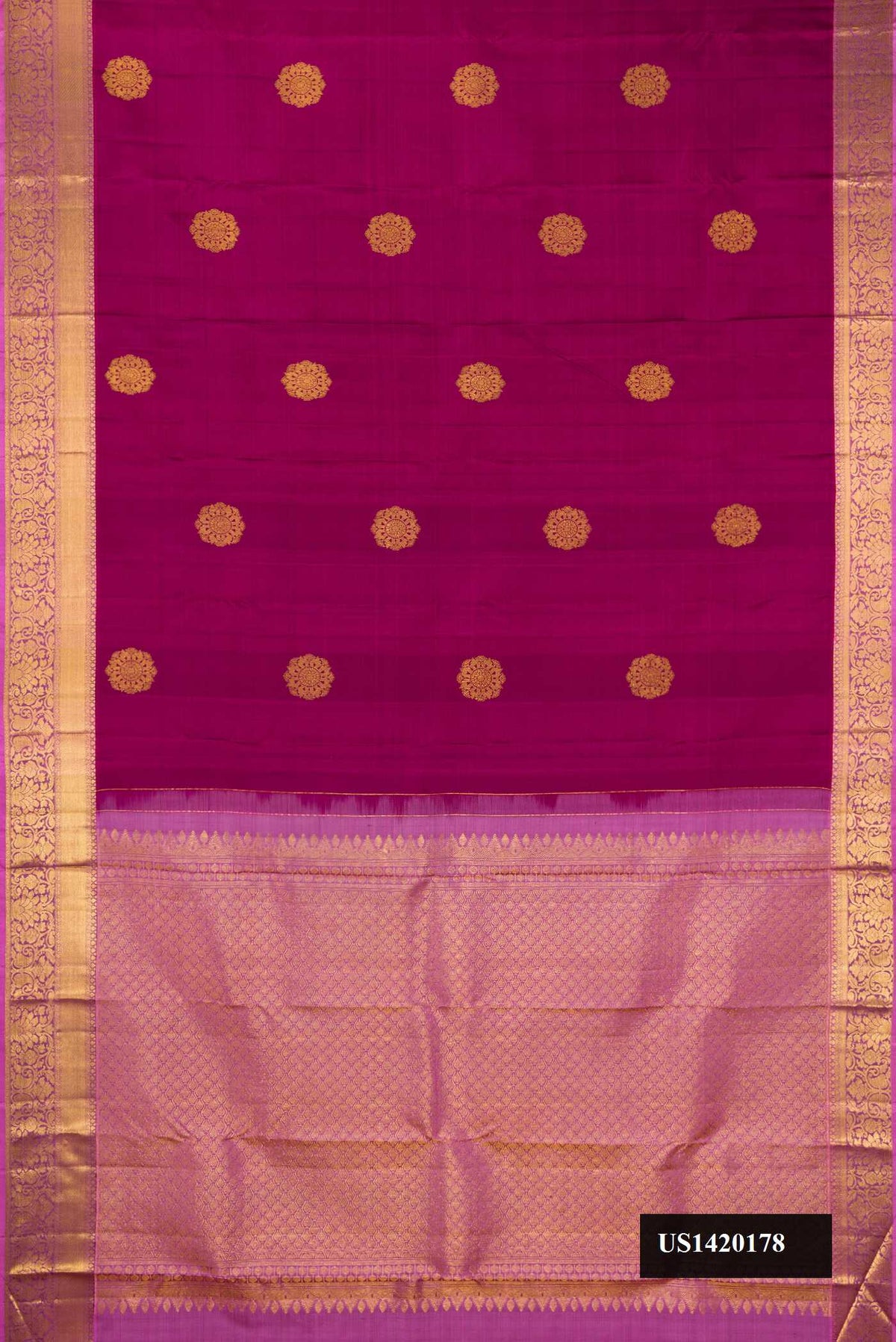 Magenta Dual Tone Kanchipuram Silk Saree with Zari Butta on the body and Zari Border.  displayed on a mannequin