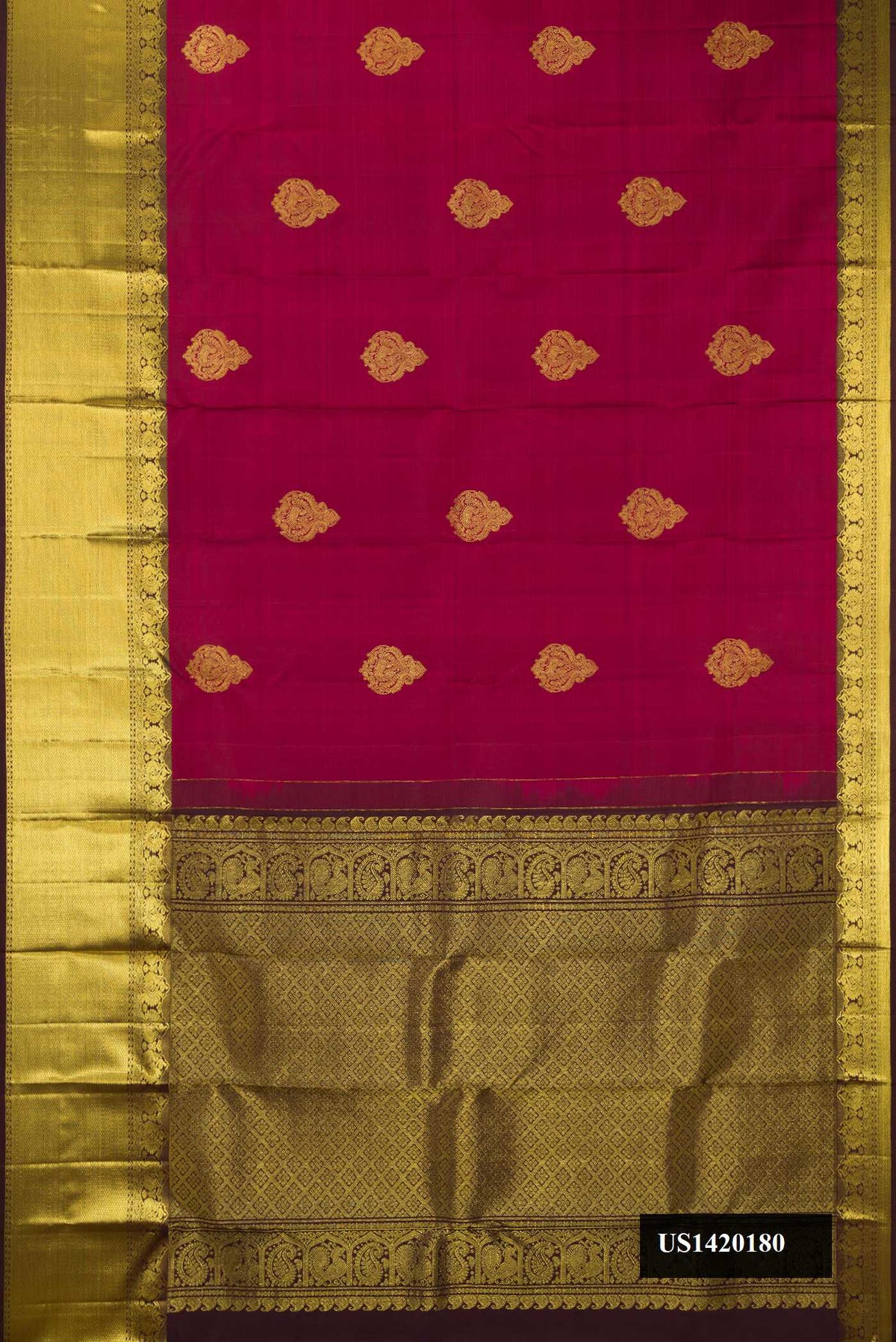Maroon Dual Tone Kanchipuram Silk Saree with Zari Butta on the body and Zari Border.  displayed on a mannequin