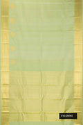 Pista Green Dual Tone Kanchipuram Silk Saree with Zari Butta on the body and Zari Border.  displayed on a mannequin