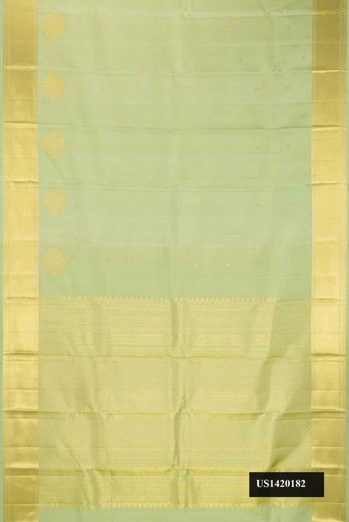 Pista Green Dual Tone Kanchipuram Silk Saree with Zari Butta on the body and Zari Border.  displayed on a mannequin