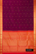 Burgundy Dual Tone Kanchipuram Silk Saree with Zari Butta on the body and Zari Border.  displayed on a mannequin
