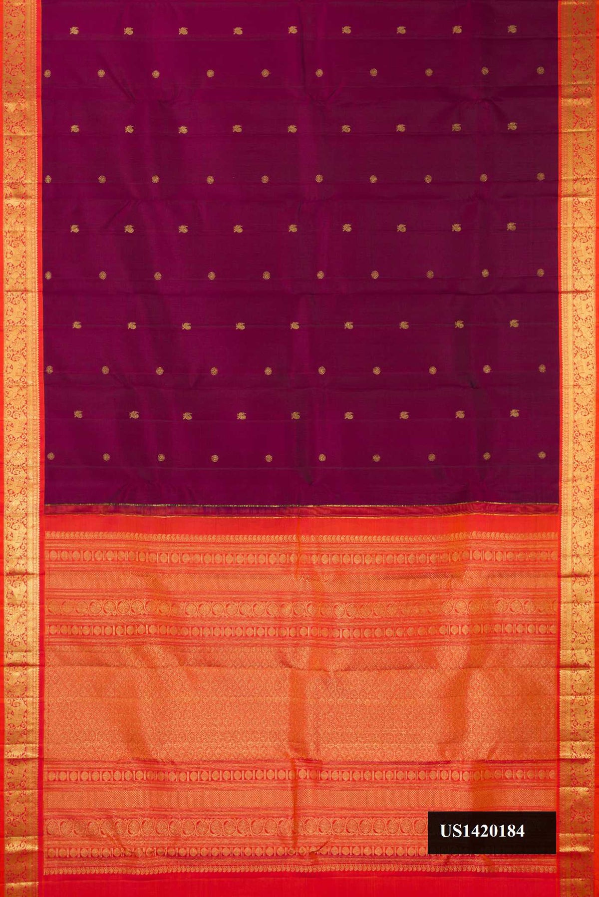 Burgundy Dual Tone Kanchipuram Silk Saree with Zari Butta on the body and Zari Border.  displayed on a mannequin