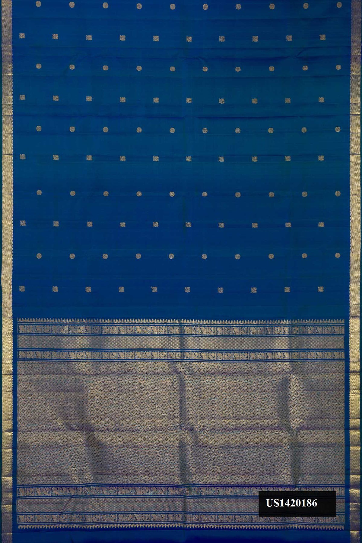 Peacock Blue Dual Tone Kanchipuram Silk Saree with Zari Butta on the body and Zari Border.  displayed on a mannequin