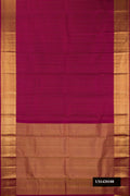 Maroon Dual Tone Kanchipuram Silk Saree with Zari Butta on the body and Zari Border.  displayed on a mannequin