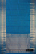 Peacock Blue Dual Tone Kanchipuram Silk Saree with Zari Butta on the body and Zari Border.  displayed on a mannequin