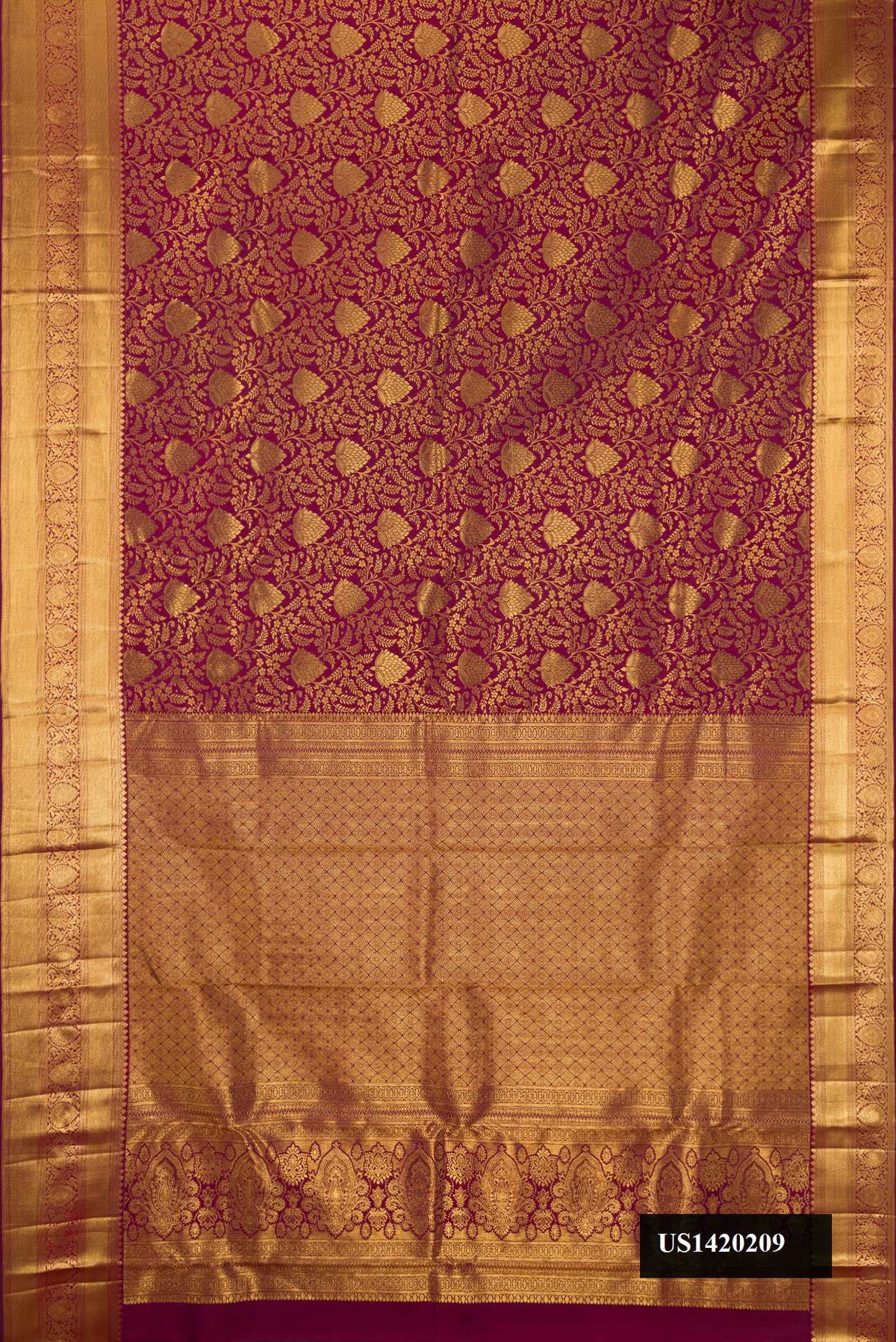 Maroon Dual Tone Kanchipuram Silk Saree with Zari Brocade on the body and Zari Border.  displayed on a mannequin