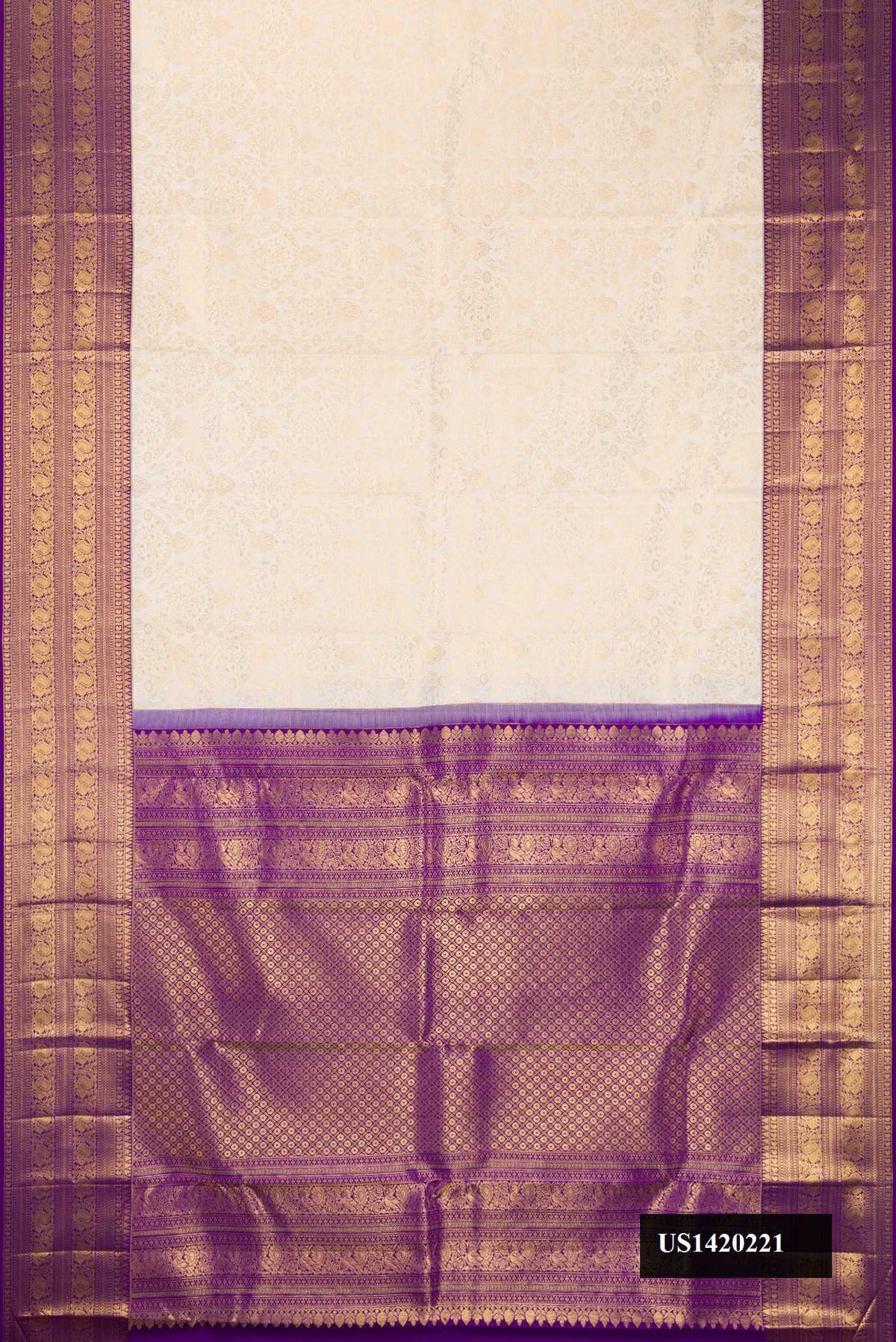 Off White Dual Tone Kanchipuram Silk Saree with Zari Brocade on the body and Zari Border.  displayed on a mannequin