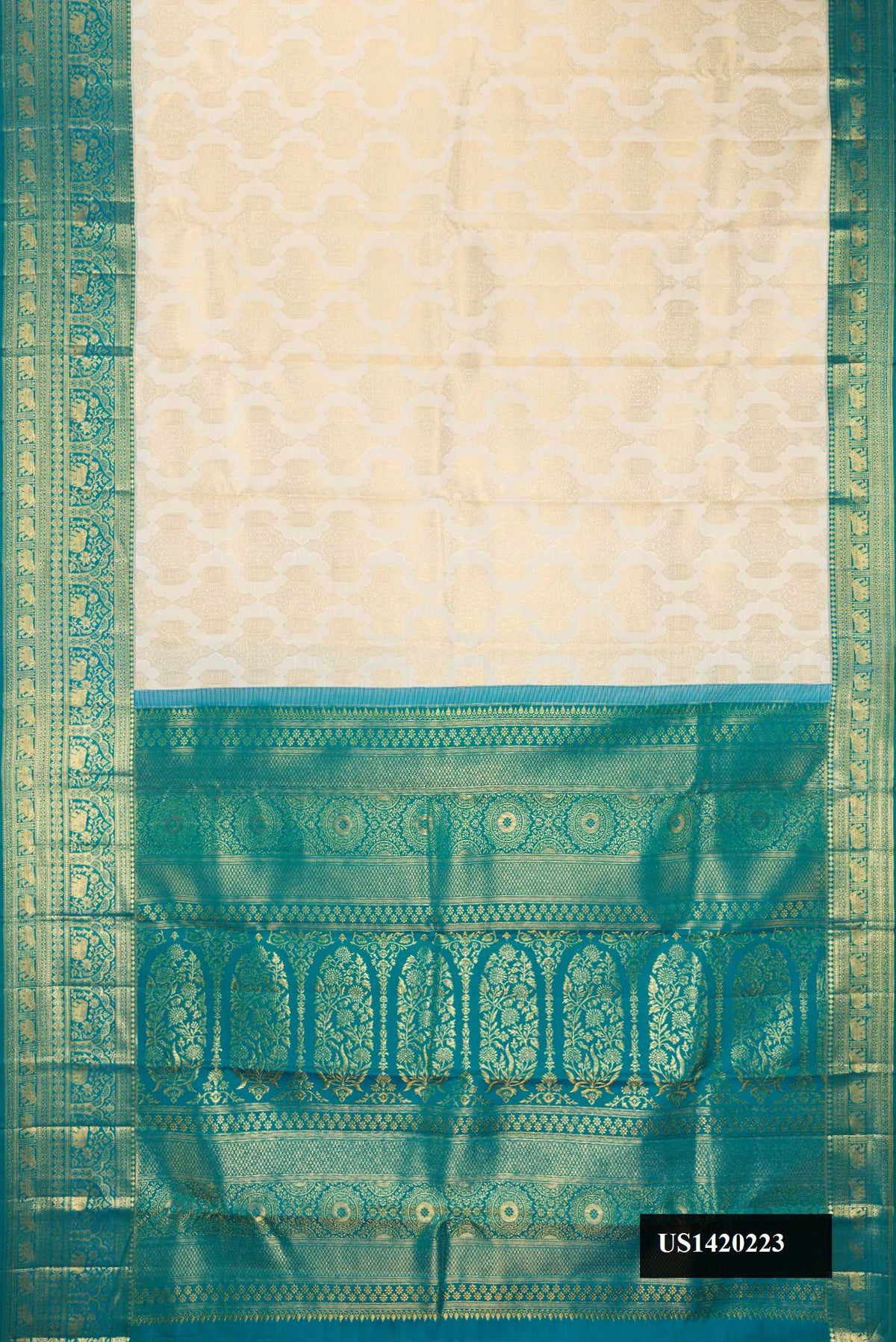 Off White Dual Tone Kanchipuram Silk Saree with Zari Brocade on the body and Zari Border.  displayed on a mannequin