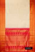 Off White Dual Tone Kanchipuram Silk Saree with Zari Brocade on the body and Zari Border.  displayed on a mannequin
