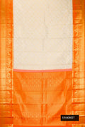 Off White Dual Tone Kanchipuram Silk Saree with Zari Brocade on the body and Zari Border.  displayed on a mannequin