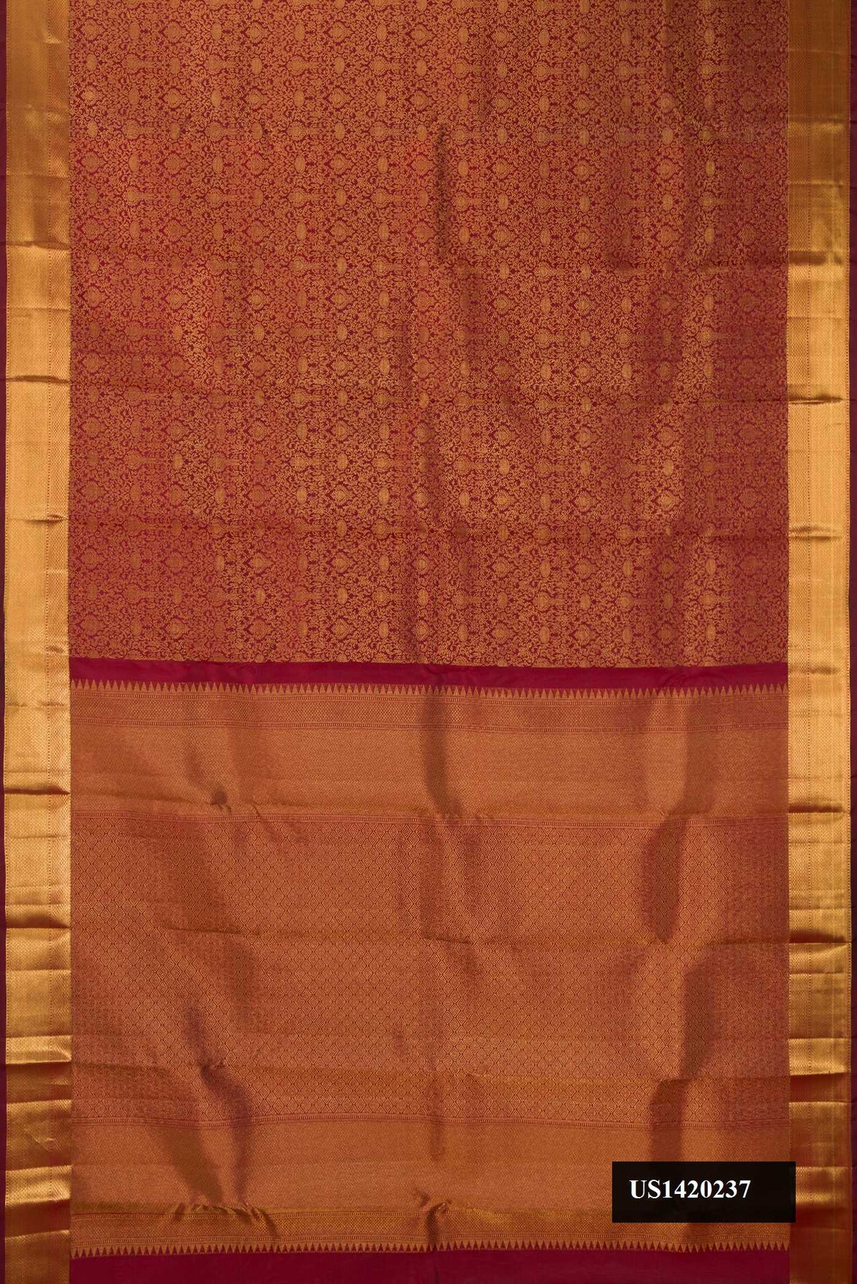 Maroon Dual Tone Kanchipuram Silk Saree with Zari Brocade on the body and Zari Border.  displayed on a mannequin