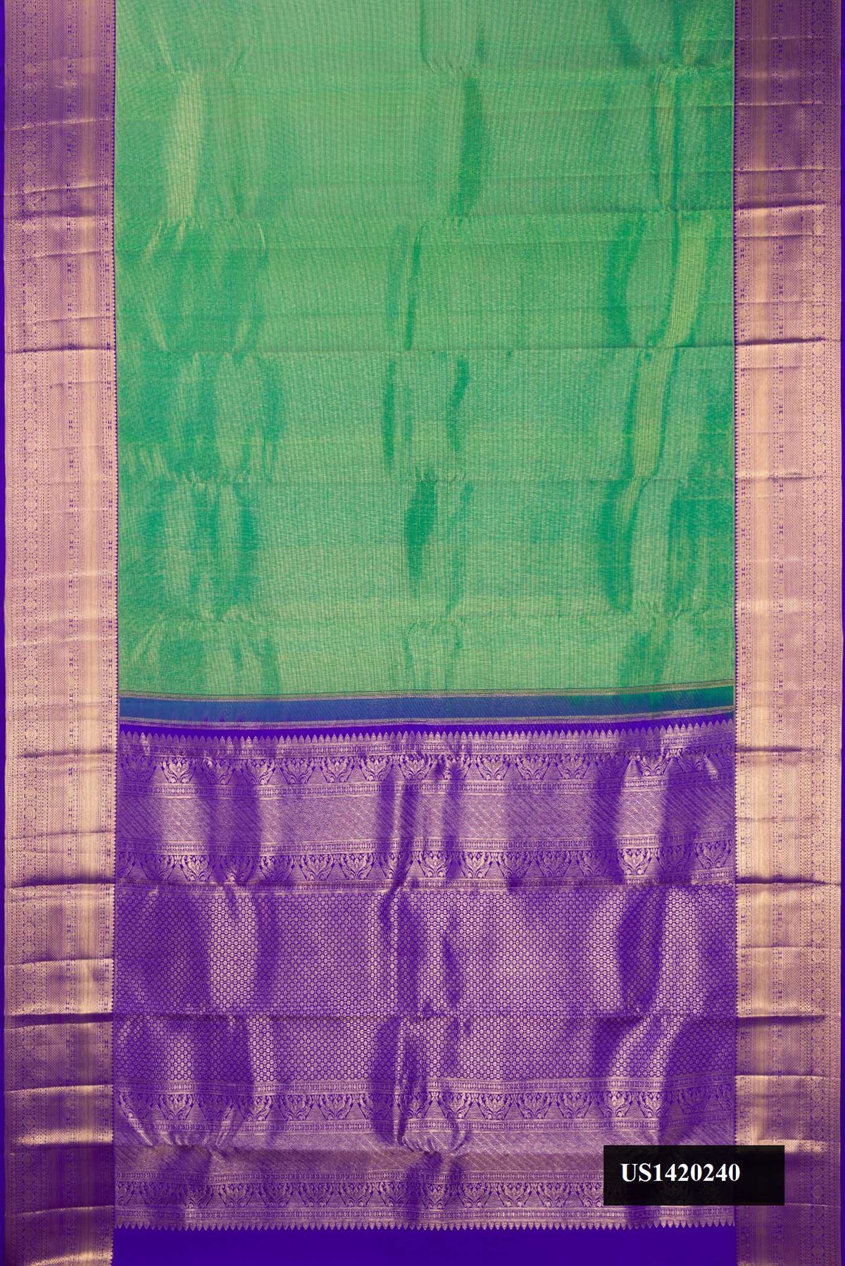 Green Dual Tone Kanchipuram Silk Saree with Zari Brocade on the body and Zari Border.  displayed on a mannequin