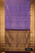 Lavender Dual Tone Kanchipuram Silk Saree with Zari Brocade on the body and Zari Border.  displayed on a mannequin