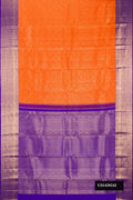 Orange Dual Tone Kanchipuram Silk Saree with Zari Brocade on the body and Zari Border.  displayed on a mannequin