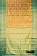 Gold Dual Tone Kanchipuram Tissue Silk Saree with Zari Brocade on the body and Zari Border.  displayed on a mannequin