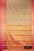 Gold Dual Tone Kanchipuram Tissue Silk Saree with Zari Brocade on the body and Zari Border.  displayed on a mannequin
