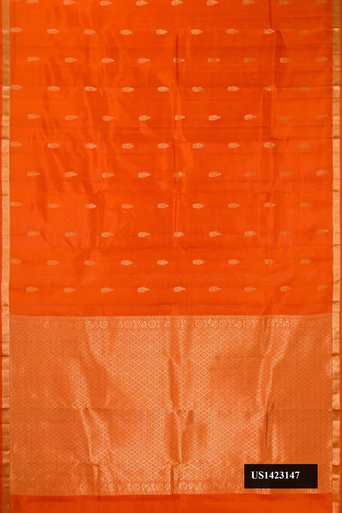 Orange Dual Tone Kanchipuram Silk Saree with Stripes on the body and Zari Border.  displayed on a mannequin