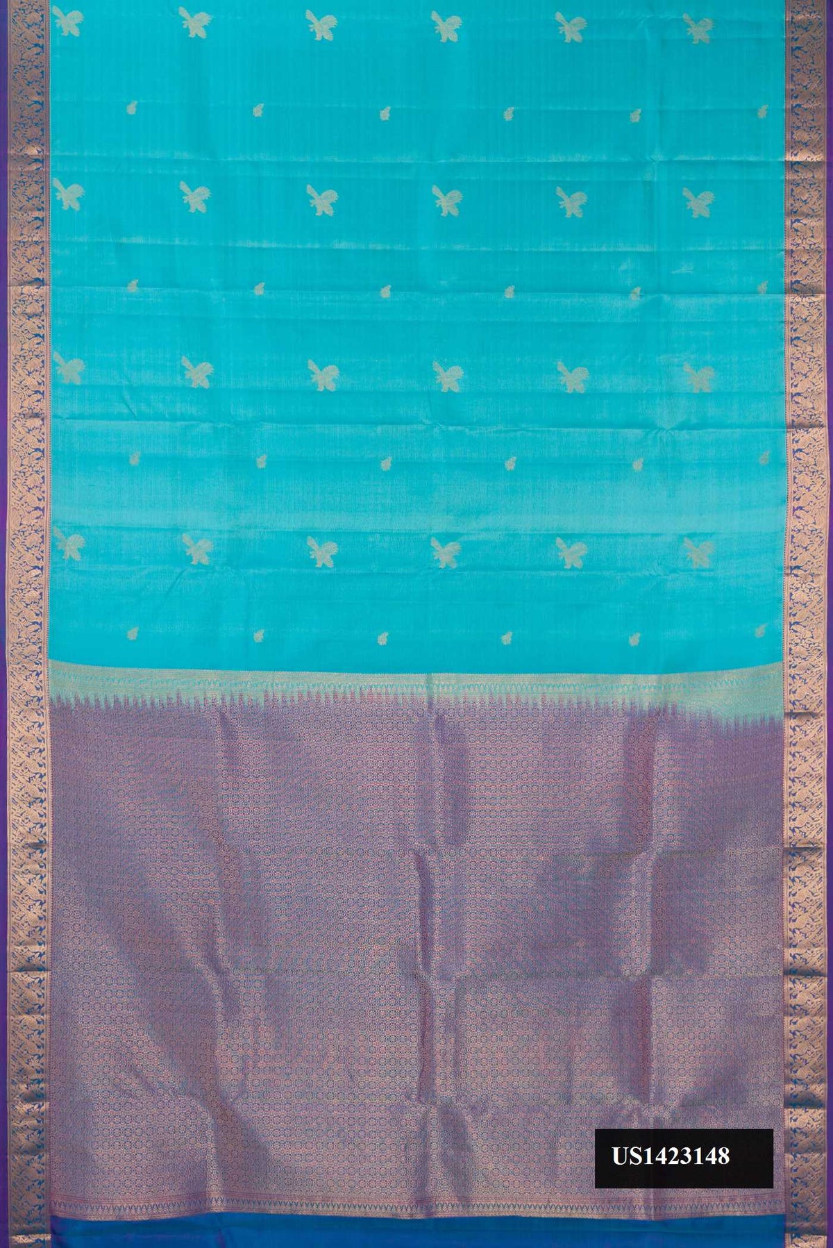 Sky Blue Dual Tone Kanchipuram Silk Saree with Zari Butta on the body and Zari Border.  displayed on a mannequin