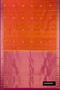 Rust Dual Tone Kanchipuram Silk Saree with Zari Butta on the body and Zari Border.  displayed on a mannequin
