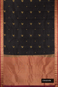 Black Dual Tone Kanchipuram Silk Saree with Zari Butta on the body and Zari Border.  displayed on a mannequin