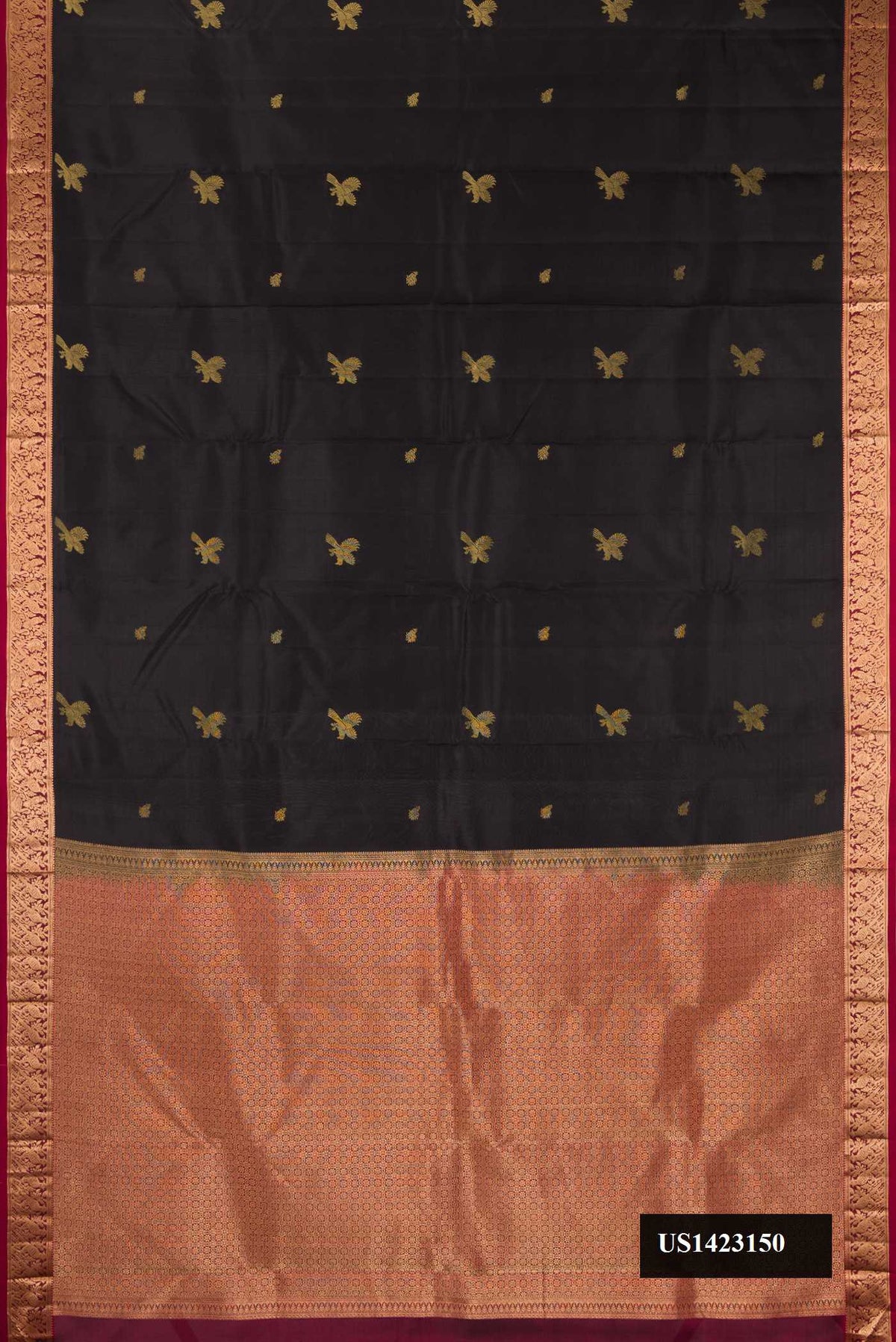 Black Dual Tone Kanchipuram Silk Saree with Zari Butta on the body and Zari Border.  displayed on a mannequin