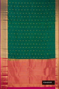 Green Dual Tone Kanchipuram Silk Saree with Zari Butta on the body and Zari Border.  displayed on a mannequin